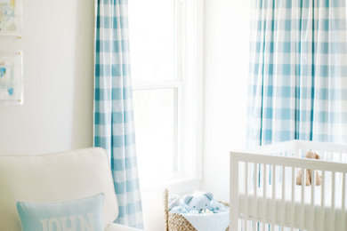 Nursery - transitional boy carpeted nursery idea in Austin with white walls