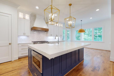 Large trendy eat-in kitchen photo in Raleigh with an island