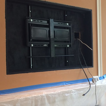 Above the fireplace Custom Framed Television