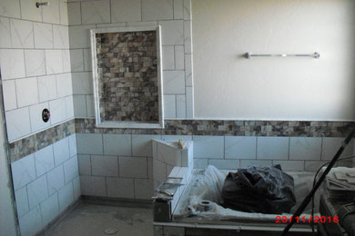 Elegant white tile bathroom photo in Other with white walls