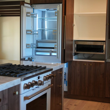 Integrated Refrigerator and Walnut Appliance Wall