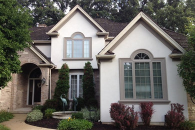 Large trendy white two-story mixed siding exterior home photo in Chicago