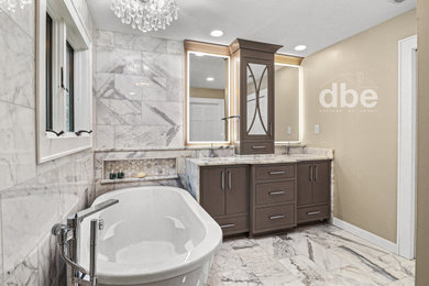Example of a large master white tile and marble tile marble floor, white floor and double-sink bathroom design in Other with flat-panel cabinets, brown cabinets, a bidet, beige walls, an undermount sink, marble countertops, white countertops, a niche and a built-in vanity