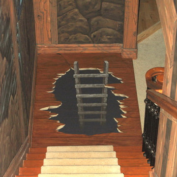 The Bat Cave Themed Mural in a stairway and lower level by Tom Taylor