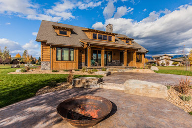 Mid-sized rustic brown two-story wood gable roof idea in Other