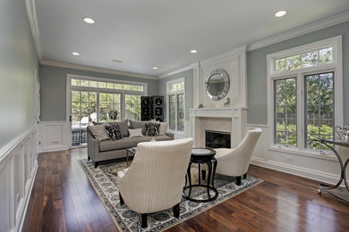 Large transitional formal and enclosed dark wood floor and brown floor living room photo in Detroit with gray walls, a standard fireplace, a tile fireplace and no tv
