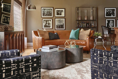 Living room - large mid-century modern enclosed light wood floor living room idea in Orlando with a bar and brown walls