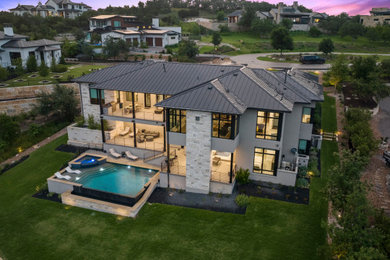 Large transitional backyard deck photo in Austin