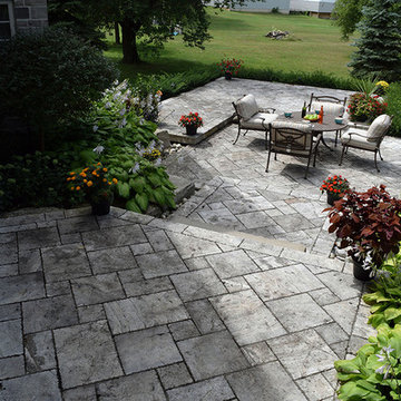 A stone deck built on steel substructure and a covered porch deck in Veka vinyl.