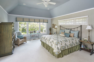 Example of a large classic master carpeted bedroom design in Chicago with blue walls and no fireplace