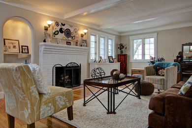 Living room - mid-sized traditional open concept light wood floor living room idea in Boston with beige walls, a standard fireplace, a brick fireplace and no tv