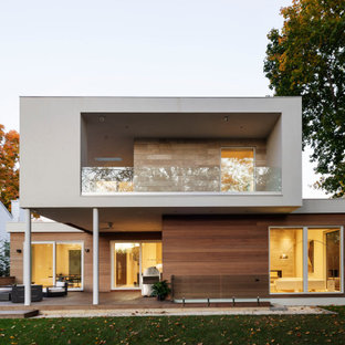 Mid-sized minimalist multicolored two-story mixed siding exterior home photo in New York