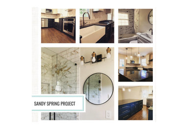 Inspiration for a mid-sized galley bamboo floor and brown floor eat-in kitchen remodel in Atlanta with a farmhouse sink, open cabinets, black cabinets, granite countertops, beige backsplash, ceramic backsplash, stainless steel appliances, an island and black countertops
