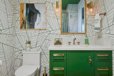Inspiration for a mid-century modern 3/4 brown floor, single-sink and wallpaper bathroom remodel in Sacramento with green cabinets, multicolored walls, an undermount sink, white countertops and a built-in vanity