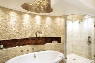 Inspiration for a large contemporary master beige tile and stone tile travertine floor and beige floor bathroom remodel in Atlanta with flat-panel cabinets, dark wood cabinets, beige walls, an undermount sink, marble countertops and a hinged shower door