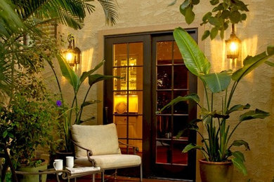 Inspiration for a mid-sized transitional courtyard stone patio remodel in Denver with no cover