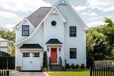 Inspiration for a mid-sized transitional gray two-story concrete fiberboard and clapboard house exterior remodel in Newark with a hip roof, a shingle roof and a black roof