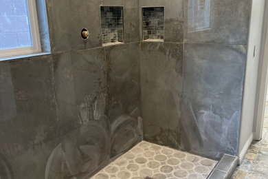 Bathroom - mid-sized contemporary master blue tile and ceramic tile ceramic tile, blue floor, double-sink and wall paneling bathroom idea in Las Vegas with furniture-like cabinets, black cabinets, a one-piece toilet, white walls, a vessel sink, granite countertops, green countertops and a freestanding vanity