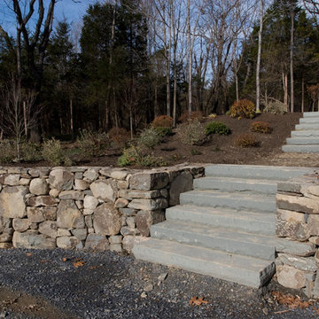 Masonry retaining wall and stairs