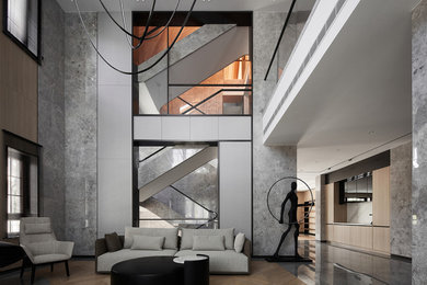 Example of a large trendy formal and open concept painted wood floor, brown floor, wood ceiling and wall paneling living room design in Los Angeles with multicolored walls, no fireplace and a media wall