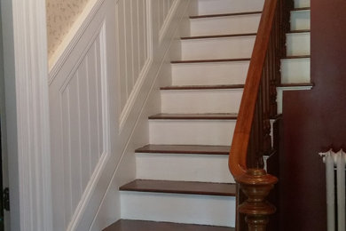 Example of a mid-sized classic wooden straight wood railing and wallpaper staircase design in Boston with wooden risers