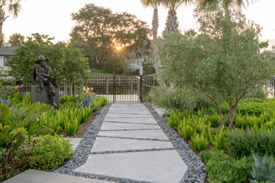 Design ideas for a mid-sized coastal full sun backyard concrete paver walkway in Jacksonville.
