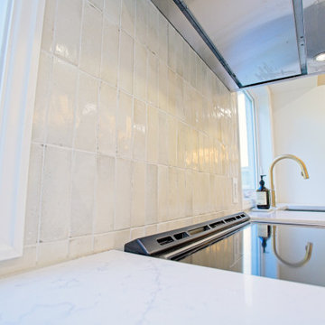 Pale Tiled Backsplash Beneath the Glass Canopy Hood | Etobicoke