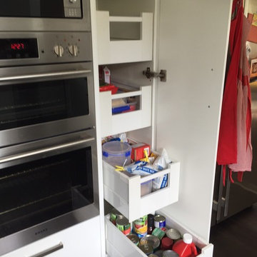 Compact kitchen with Steel Grey Granite benches and gloss white cabinetry