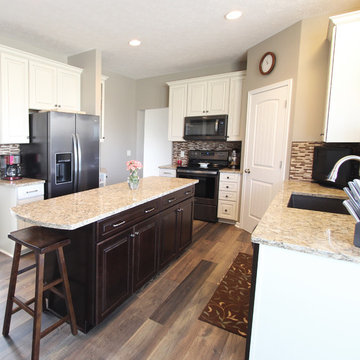 Cream Kitchen with Contrasting Dark Island with Quartz Countertop