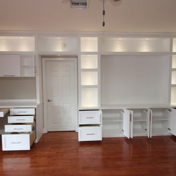 Modern Built-In Entertainment Center along with a Built-in Desk and Cabinetry