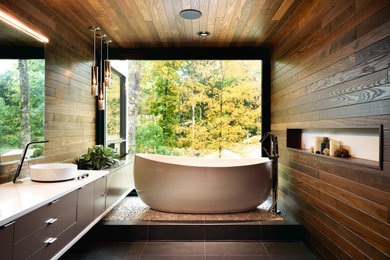 Photo of a modern bathroom in Atlanta with porcelain floors, a vessel sink and grey floor.