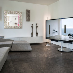 Mid-sized trendy open concept marble floor home theater photo in Munich with white walls and a media wall