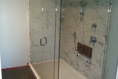 Example of a large classic 3/4 corner shower design in Vancouver with a hinged shower door
