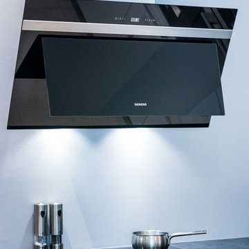 Cuisine SieMatic design en laque blanche avec un îlot central