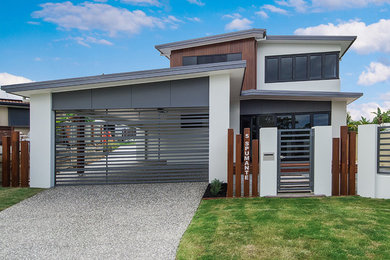 Photo of a large contemporary two-storey multi-coloured house exterior in Gold Coast - Tweed.