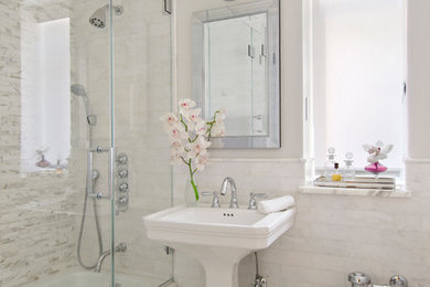 Small traditional 3/4 bathroom in Salt Lake City with an alcove tub, a shower/bathtub combo, a bidet, beige tile, stone tile, white walls, a pedestal sink, a sliding shower screen, pebble tile floors, solid surface benchtops, white floor and white benchtops.