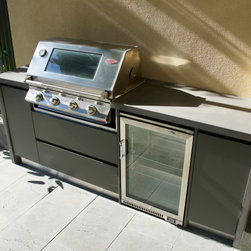 Outdoor Kitchen with a polished concrete benchtop & stainless steel doors. - Kitchen Products