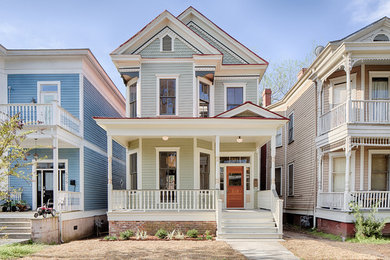 Ornate gray two-story exterior home photo in Dallas
