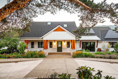 This is an example of an expansive and white bungalow detached house in Other with concrete fibreboard cladding, a pitched roof, a shingle roof, a grey roof and shiplap cladding.