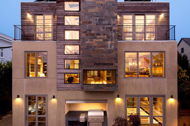 Photo of an expansive contemporary three-storey brown exterior in San Francisco with mixed siding and a flat roof.