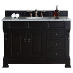 James Martin Vanities - Brookfield 48" Single Vanity, Antique Black w/ 3CM Arctic Fall Solid Surface Top - The Brookfield 48" Antique Black vanity by James Martin Vanities features hand carved accenting filigrees and raised panel doors. Two doors open to shelves for storage below. Two drawers made up of a lower double-height drawer and a middle standard drawer, offer additional storage space, with antique brass finish door and drawer pulls. Matching wood backsplash is included. The look is completed with a 3cm eased edge Arctic Fall Solid Surface top with a white porcelain rectangular sink.