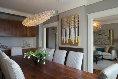 Photo of a large contemporary separate dining room in San Francisco with light hardwood floors and grey walls.