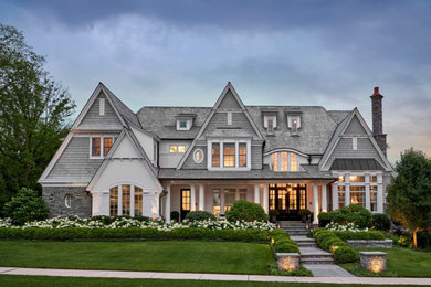 Huge coastal gray three-story wood and shingle exterior home idea in Chicago with a shingle roof and a gray roof