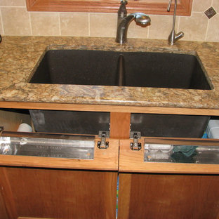 Large modern kitchen pantry designs - Example of a large minimalist l-shaped dark wood floor kitchen pantry design in Wichita with an undermount sink, flat-panel cabinets, light wood cabinets, quartz countertops, beige backsplash, ceramic backsplash, stainless steel appliances and an island