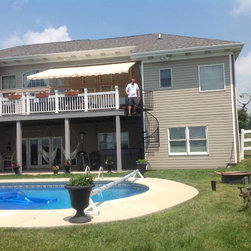 s010 Spiral Staircase with custom landing from Deck to patio in Pittsburg, Pa. - Products
