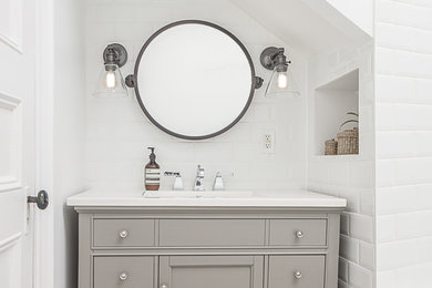 Inspiration for a timeless white tile and subway tile bathroom remodel in Other with recessed-panel cabinets, gray cabinets and white walls