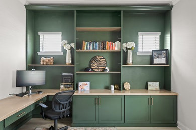 Example of a transitional home office design in Orlando