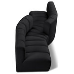Meridian Furniture - Arc Vegan Leather Upholstered 4-Pc. Facing Modular Sectional, Black - Unleash modern opulence with the Arc Vegan Leather 4pc. Sectional. Crafted for the modern connoisseur, this Sectional injects an air of refined luxury into any space. Its sleek silhouette, upholstered in supple black vegan leather, exudes timeless sophistication while the deep channel tufting adds textural intrigue, further elevating the chair's visual appeal. The modular design makes it a versatile chameleon, effortlessly adapting to your evolving needs and preferences. Whether you envision it gracing a chic living room corner, basking in the glow of a bedroom window, or adding a touch of drama to a home office, the Arc seamlessly complements your unique interior aesthetic.