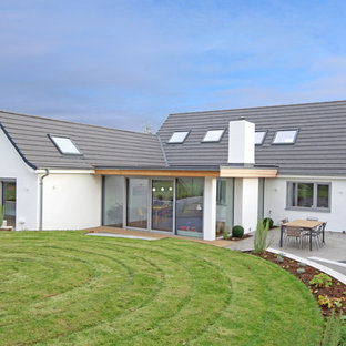 Inspiration for a large and white modern two floor render detached house in Other with a pitched roof and a tiled roof.