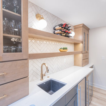 Warm & Inviting Basement Retreat with Custom Bar + Entertainment Center